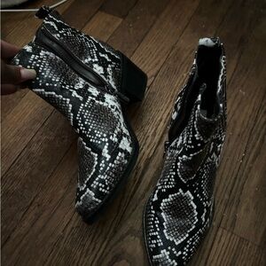 Brand new black snakeskin booties size 6 1/2 in a woman